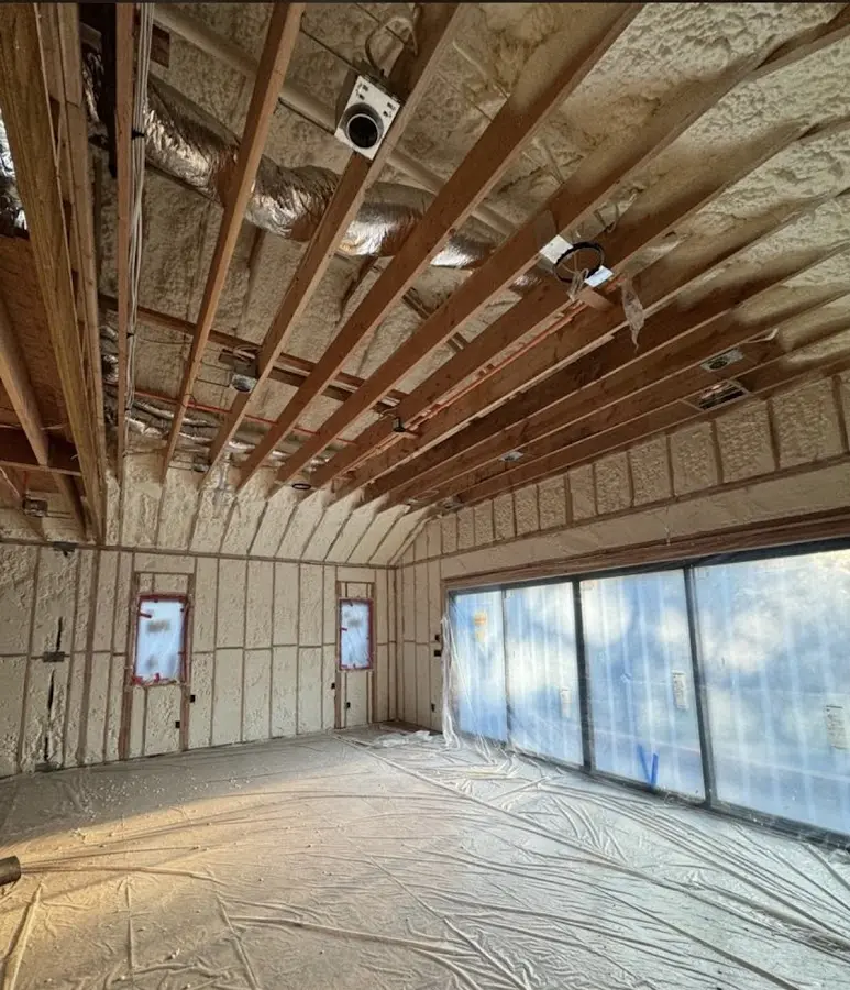 Interior walls and ceiling insulated with spray foam during new construction in Great Neck Plaza